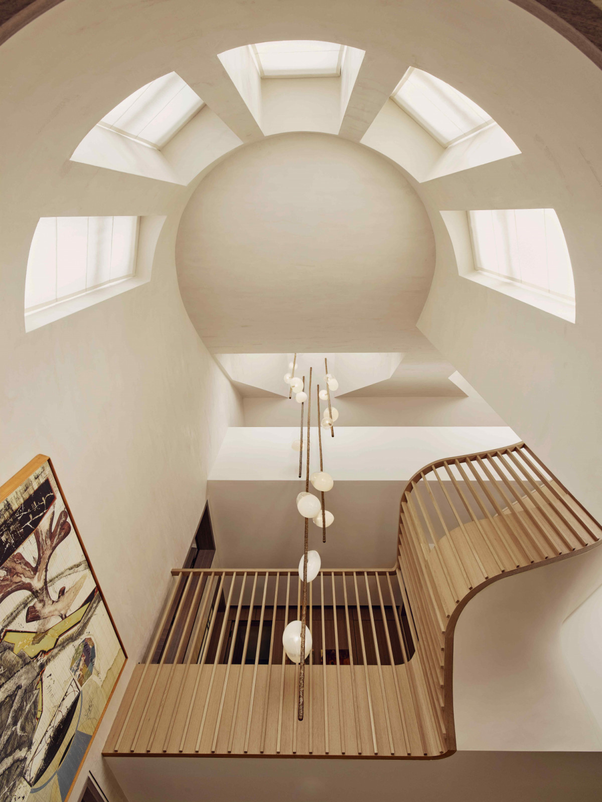 Charles Burnand’s custom-designed pendant hangs from the high ceiling