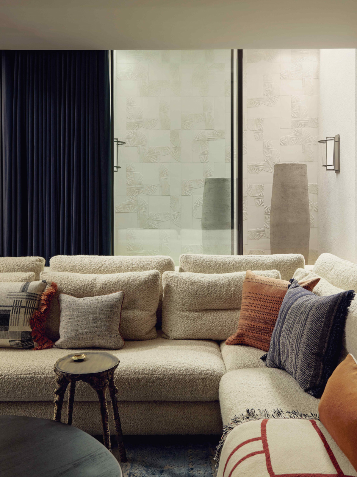 Natural light permeates into the space through a lightwell, featuring 3D tiles by Botteganove