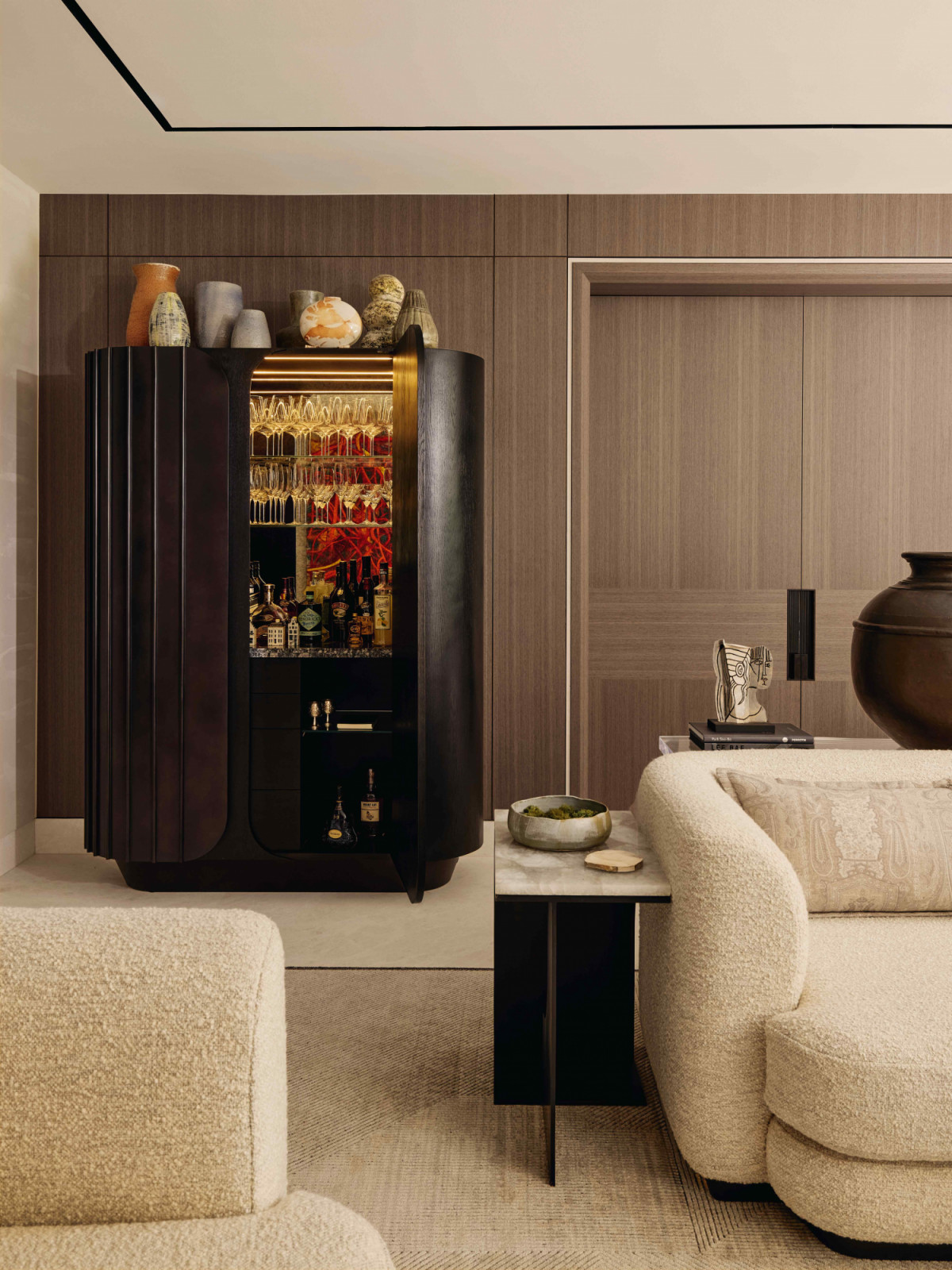 The custom bar unit tucked neatly in the corner of the living room