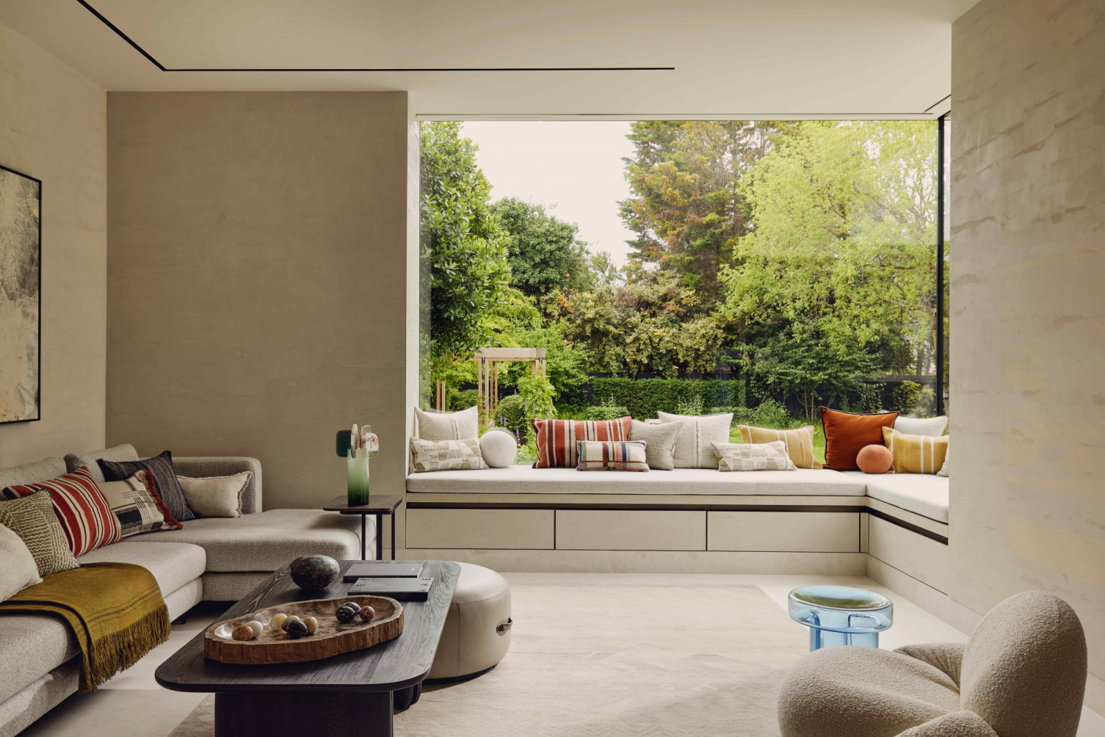 The family living room is a serene enclave with pictured views of the garden