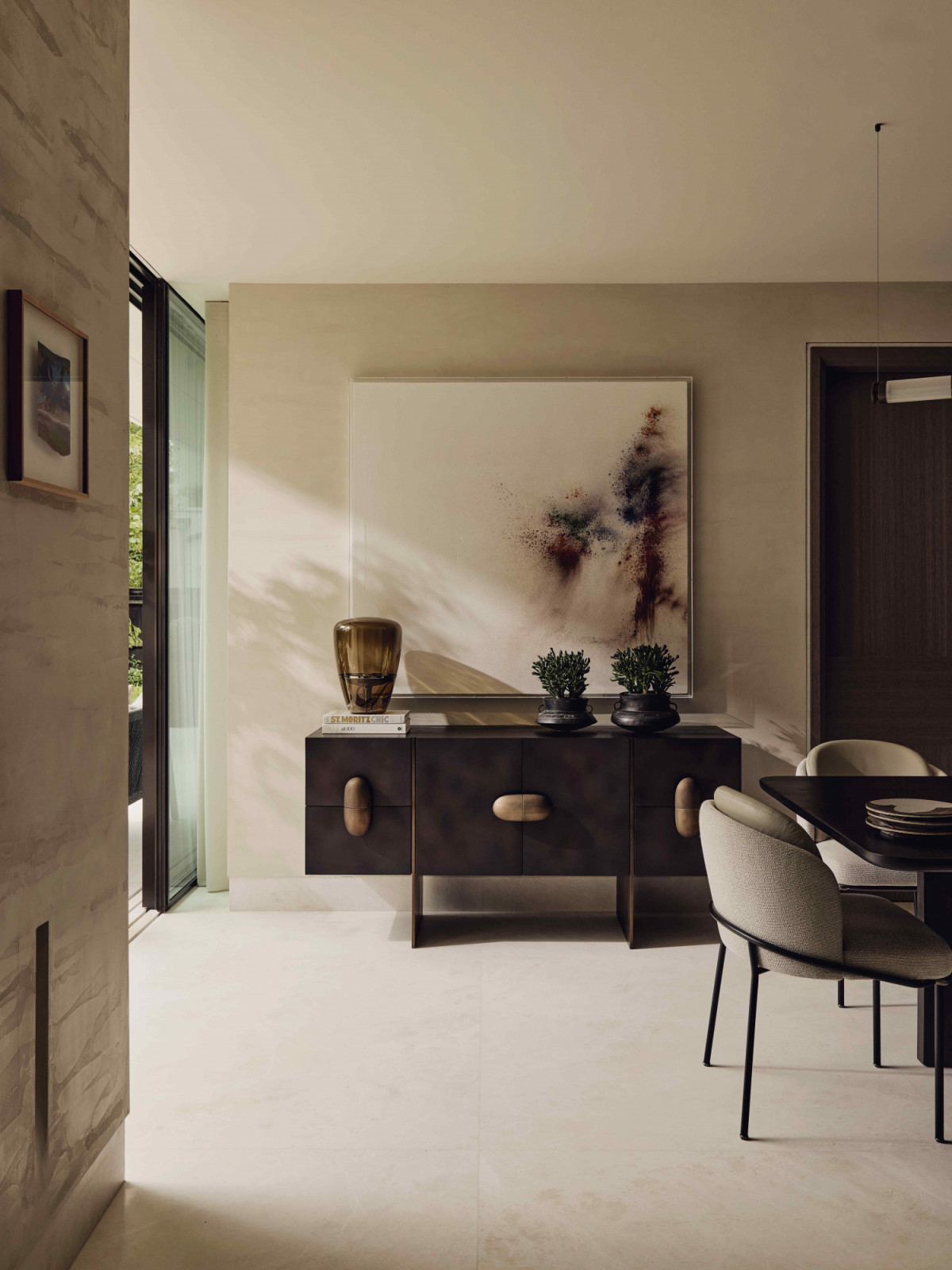 The sideboard from India matches the Minotti dining chairs