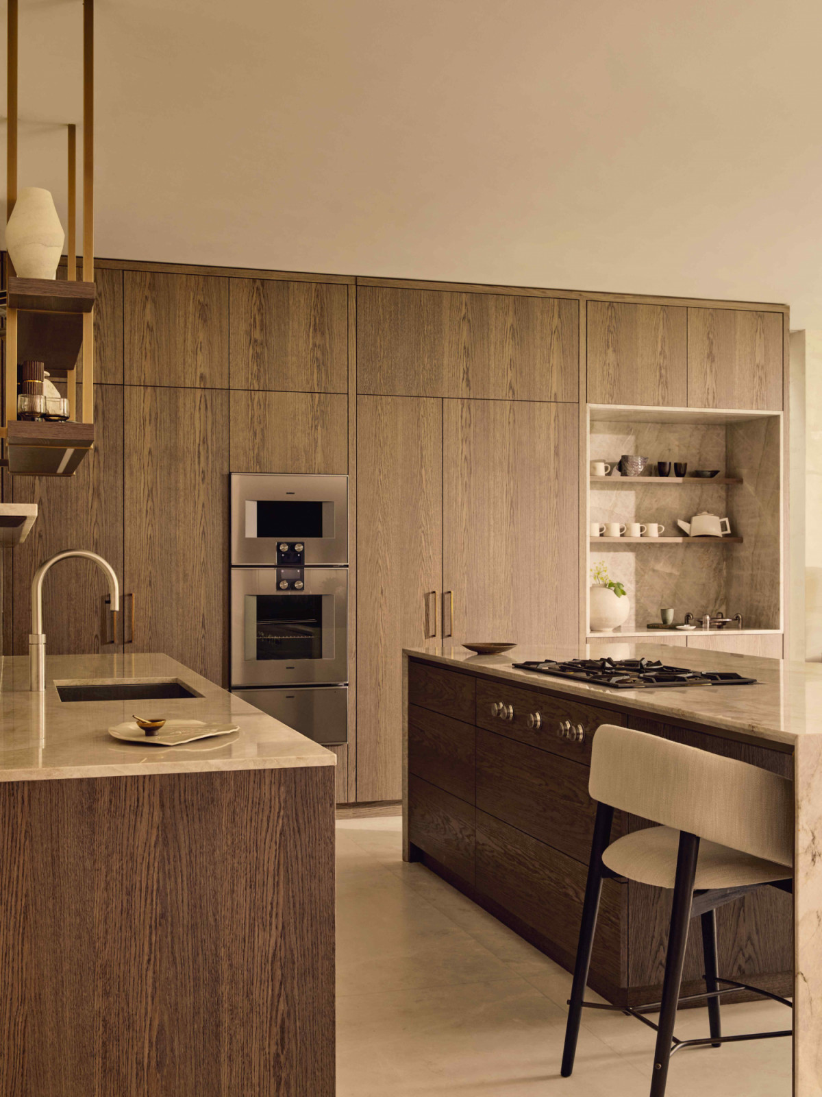 Rich and warm oak finishes persist in the kitchen space