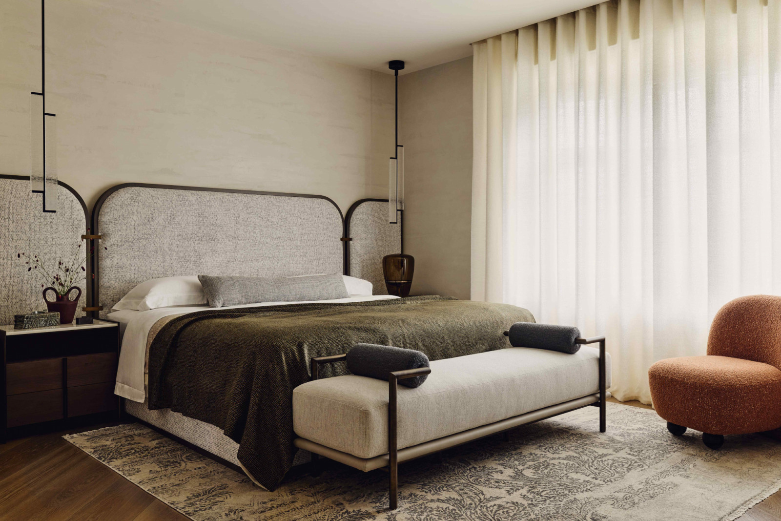 The main bedroom with a custom headboard, Kori pendants by Holly Hunt, and cashmere curtains by Alexander Lamont + Miles