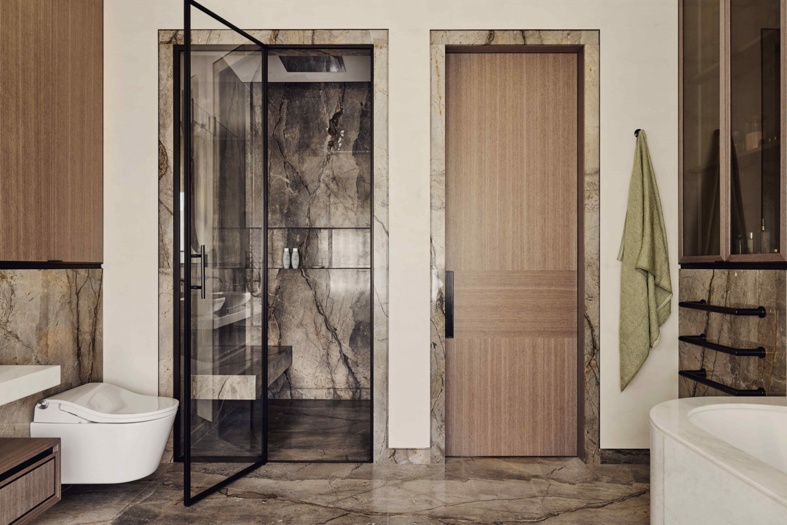 Luxurious marble juxtaposes with warm oak finishes