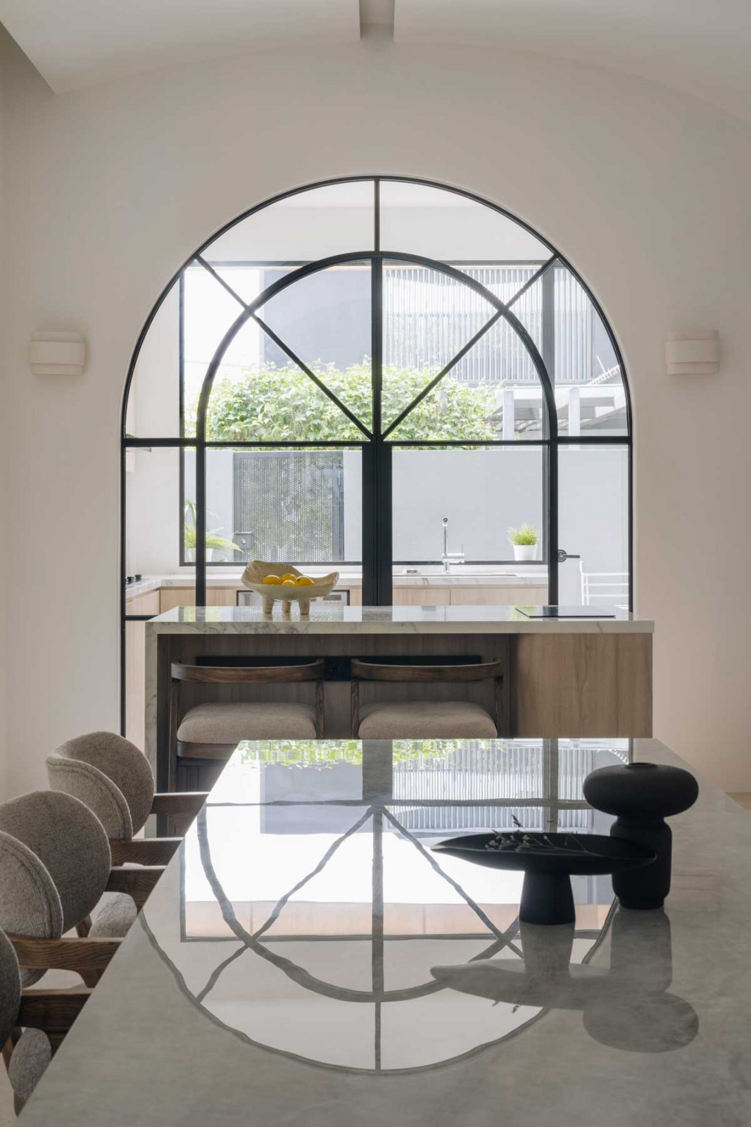 These elegant French doors separate the kitchen and the dining area