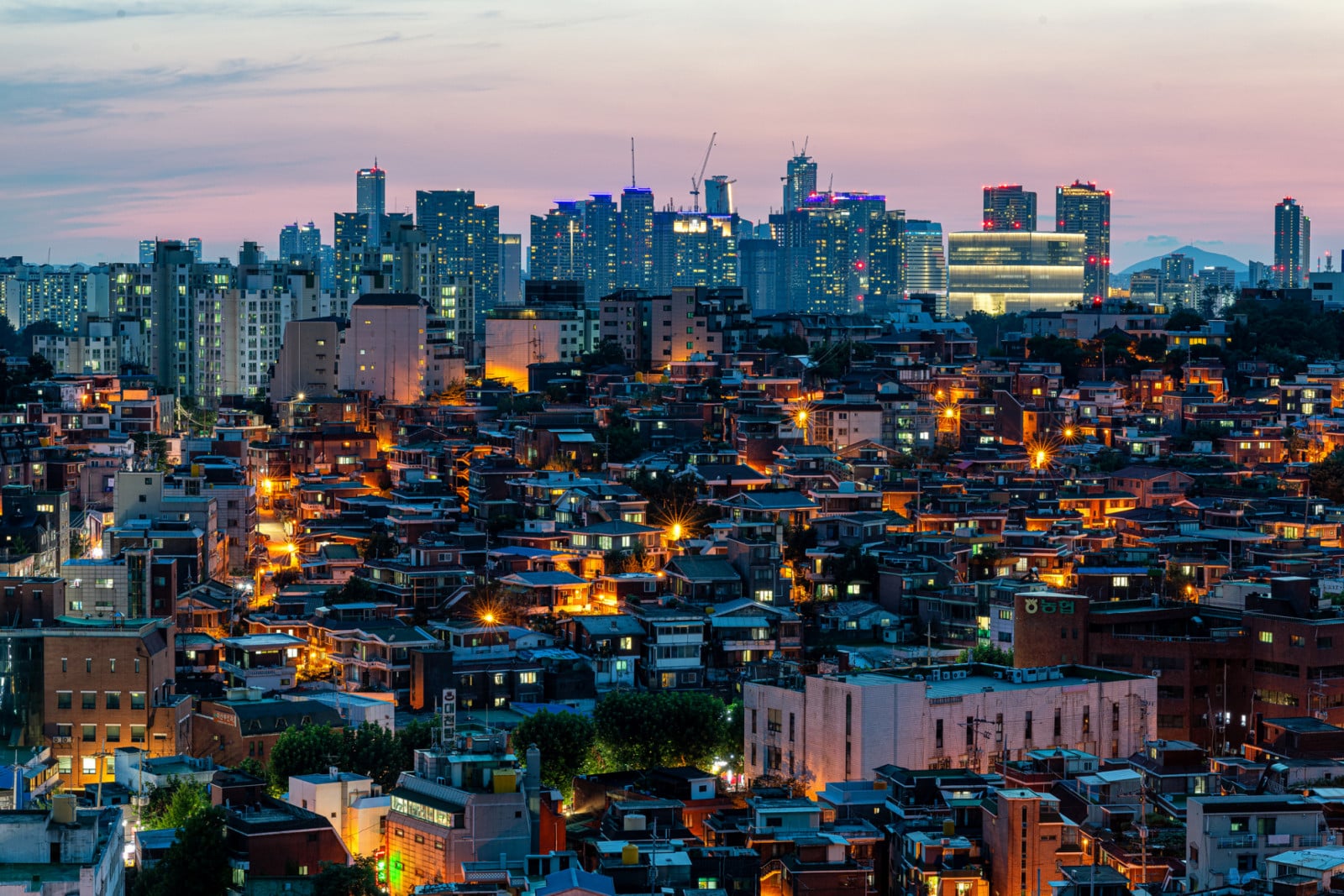 Dense residential neighbourhoods at dusk in Seoul, where 94 per cent of South Korea's major conglomerate families reside within just three elite districts (Photo: Getty)