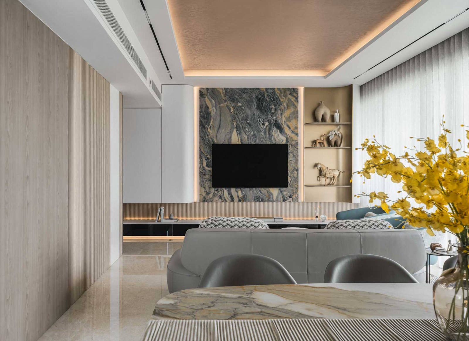 The Magma Blue quartzite feature wall takes pride of place in the living area as part of the TV console
