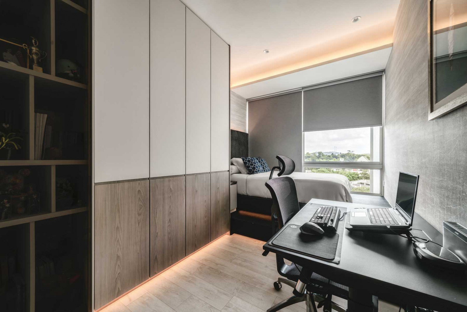 Wooden elements installed on the walls and cabinetry are juxtaposed against matte finishes