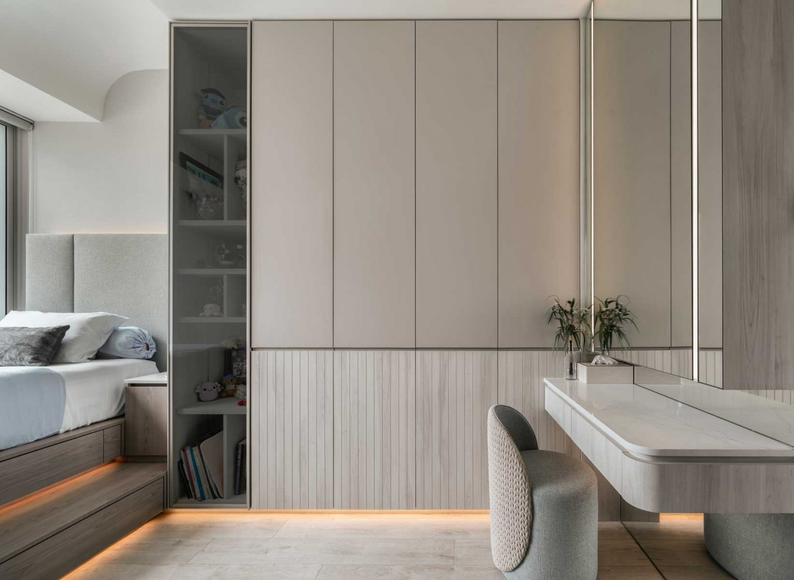 Wooden platform beds in the bedrooms hold extra storage space, helping to keep the home clutter-free