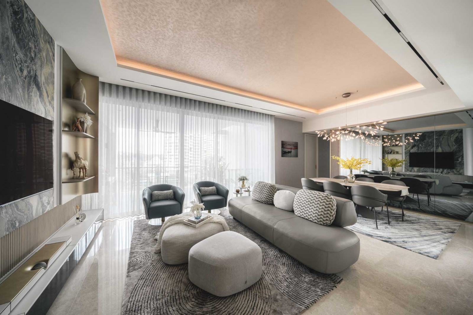 Cove lighting casts an alluring glow over the spacious living area