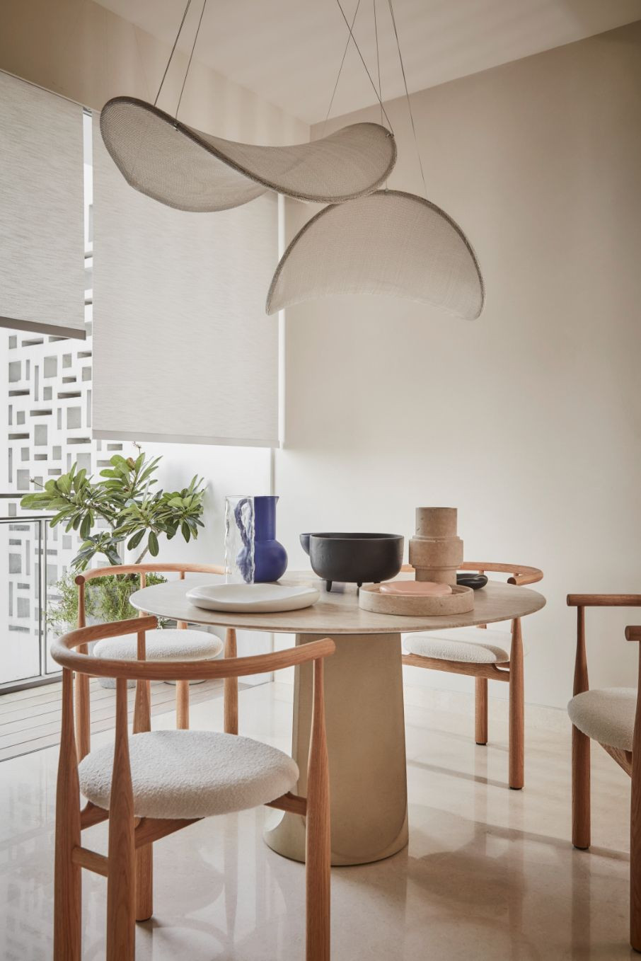 The crescent-shaped IIII pendant lamp by Sol Luminaire (Photo: Wong Weiliang / 328 Productions)