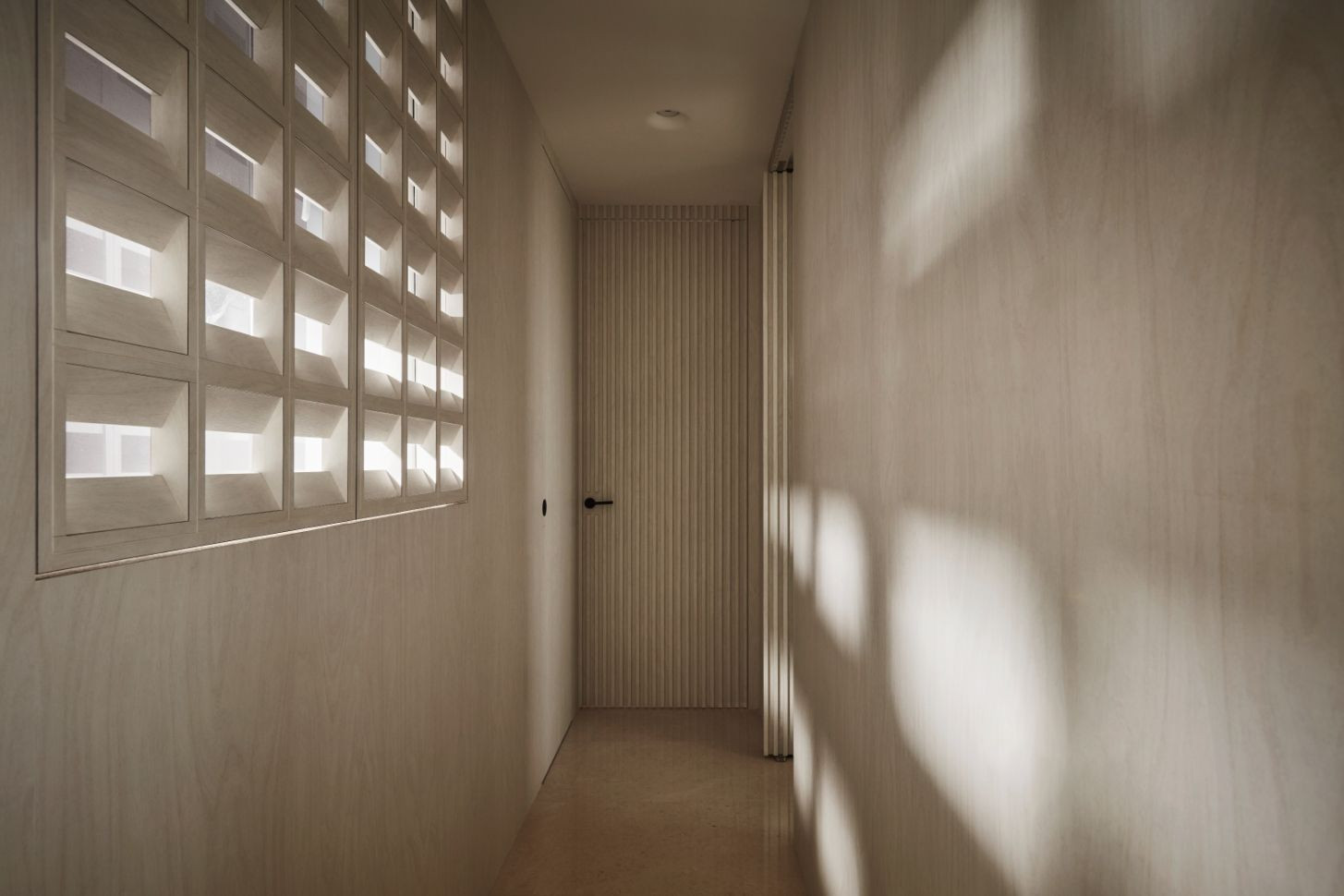 An operable brise soleil along the hallway filters sunlight (Photo: Wong Weiliang / 328 Productions)