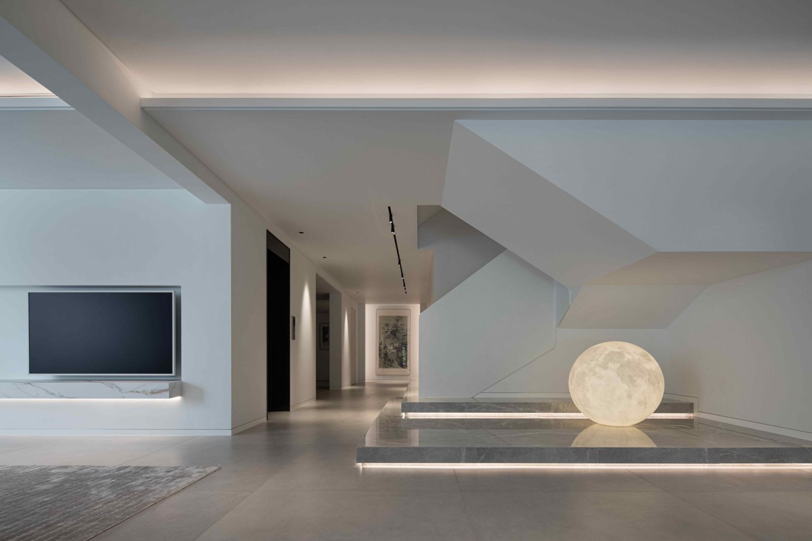 White walls and off-white stone flooring establishes a serene, understated environment (Photo: Hanmo Visual)