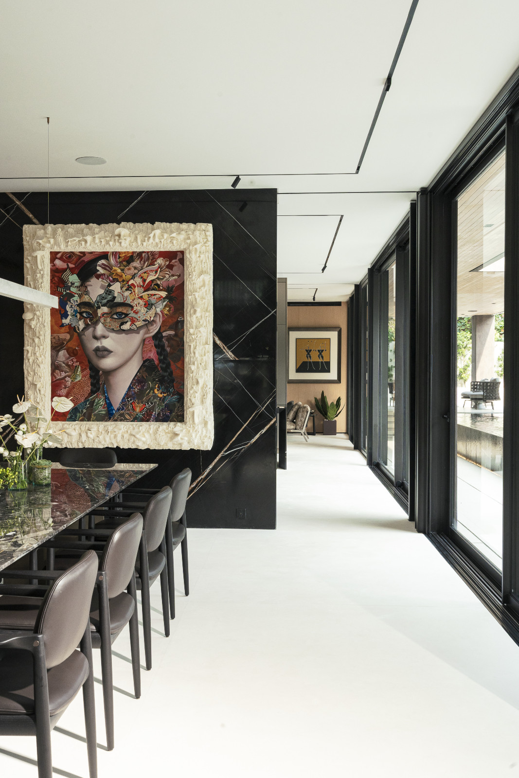 The home designed by Ed Calma unfolds room by room, with a linear surgical precision