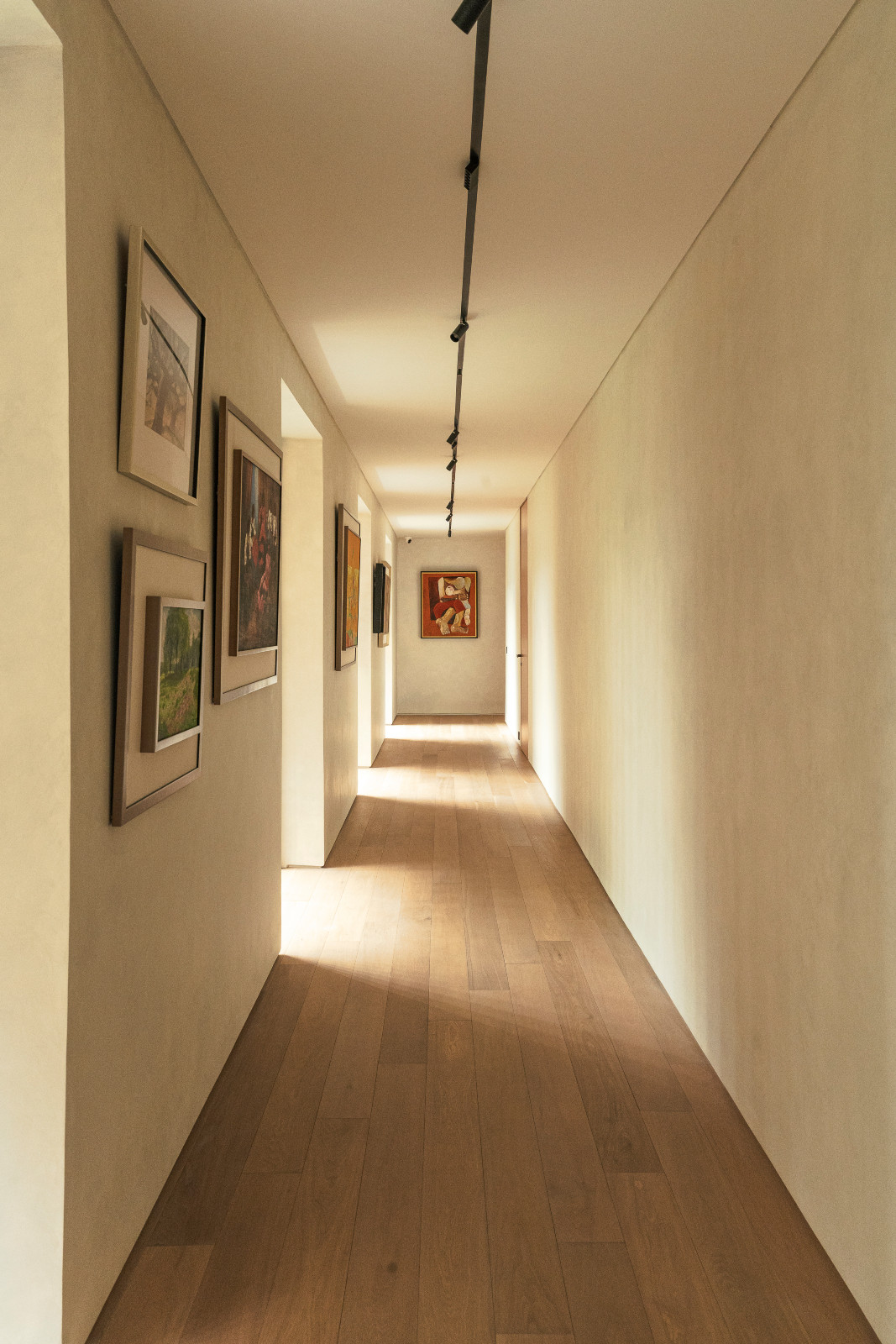 The second-floor hallway of a home designed by Ed Calma echoes the ground floor’s composition beautifully