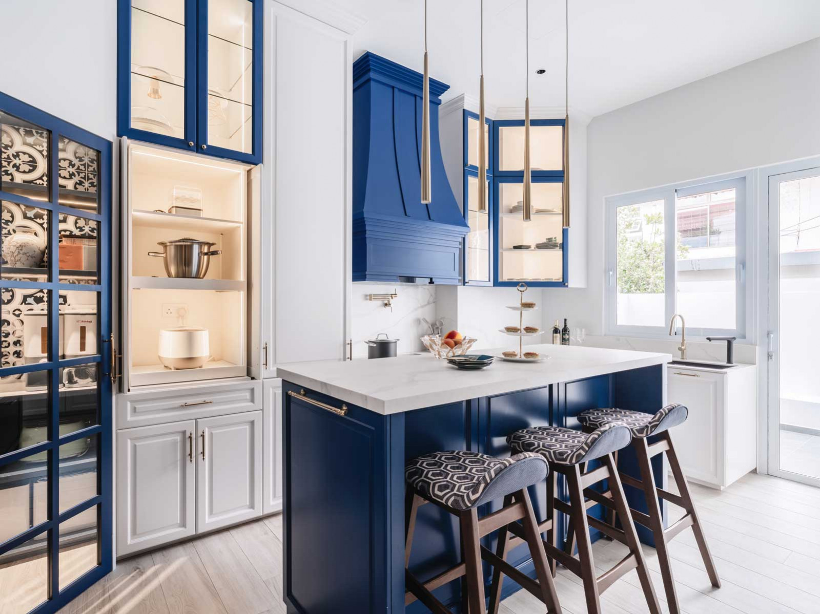 Summerhaus D’zign Serangoon terrace house - the striking blue-and-white kitchen features custom spray-painted cabinets