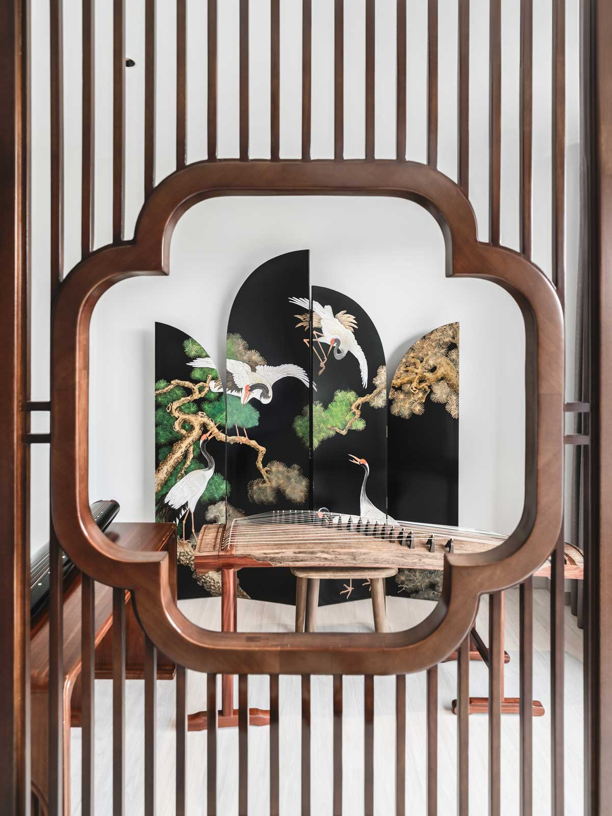 Summerhaus D’zign Serangoon terrace house - a Chinese screen divider separates the music corner from the home office