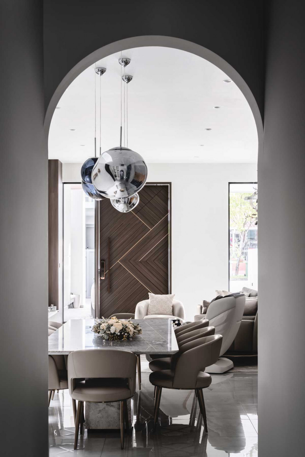 Summerhaus D’zign Serangoon terrace house - an arched walkway perfectly frames the dining area and front door