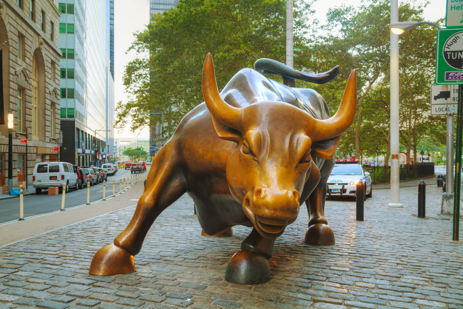 New York, USA - September 5, 2015: Charging Bull sculpture. The sculpture is both a popular tourist destination, as well as "one of the most iconic images of New York".