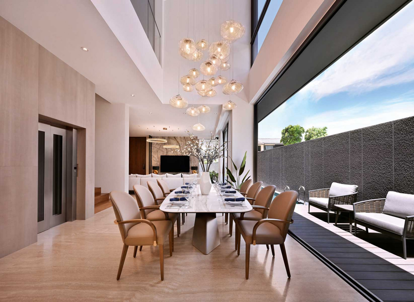 Natural light and fresh air flow in from the adjoining outdoor terrace, which also connects to the lift