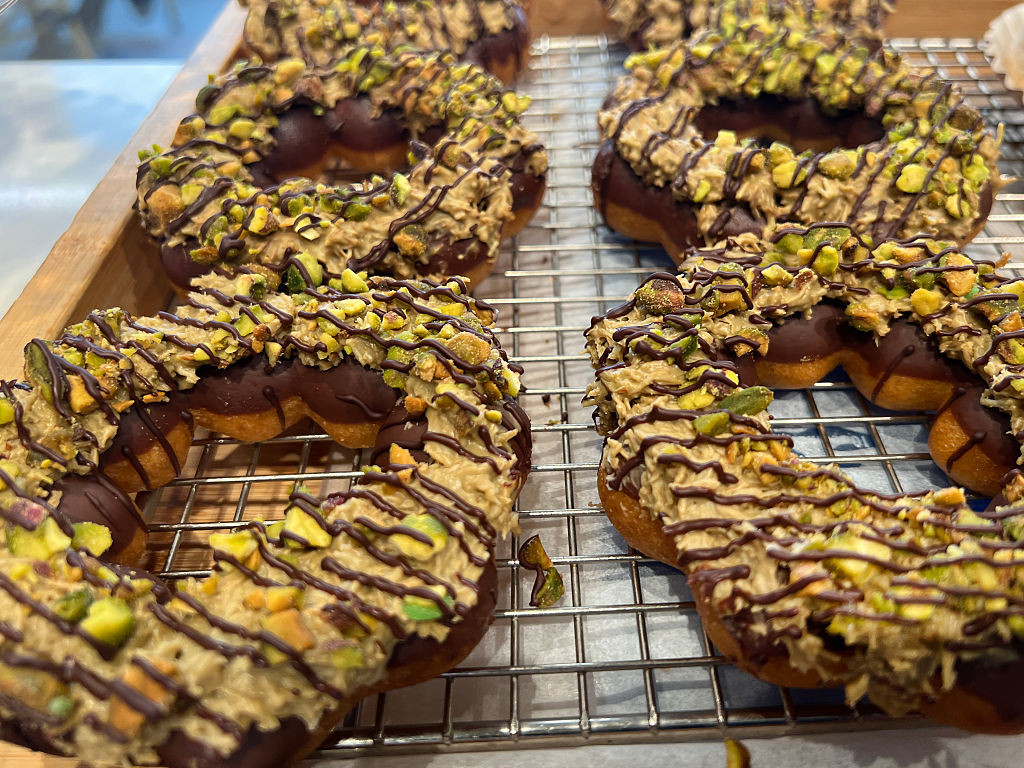 Dubai Chocolate Mochi Donuts are displayed at a bakery in Toronto, Ontario, Canada, on July 8, 2025. (Photo by Creative Touch Imaging Ltd./NurPhoto via Getty Images)