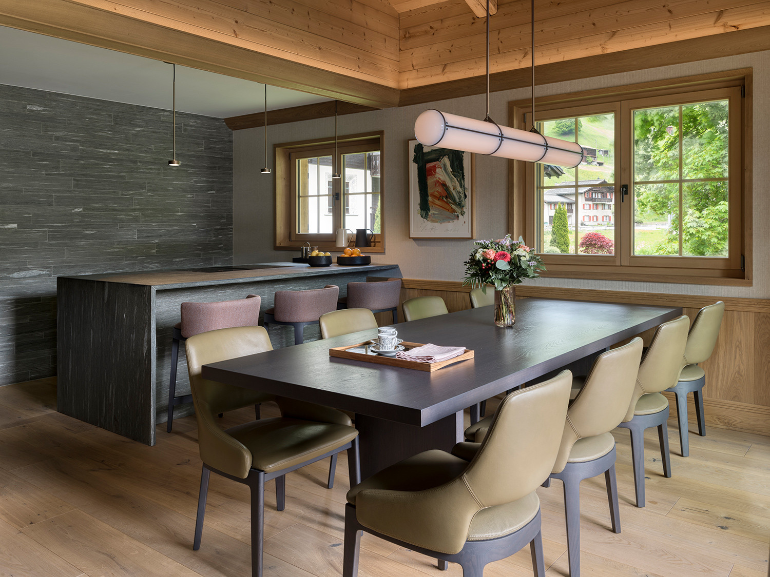 The kitchen and dining area of the Klosters, Switzerland family chalet, designed by Tollgard Studio
