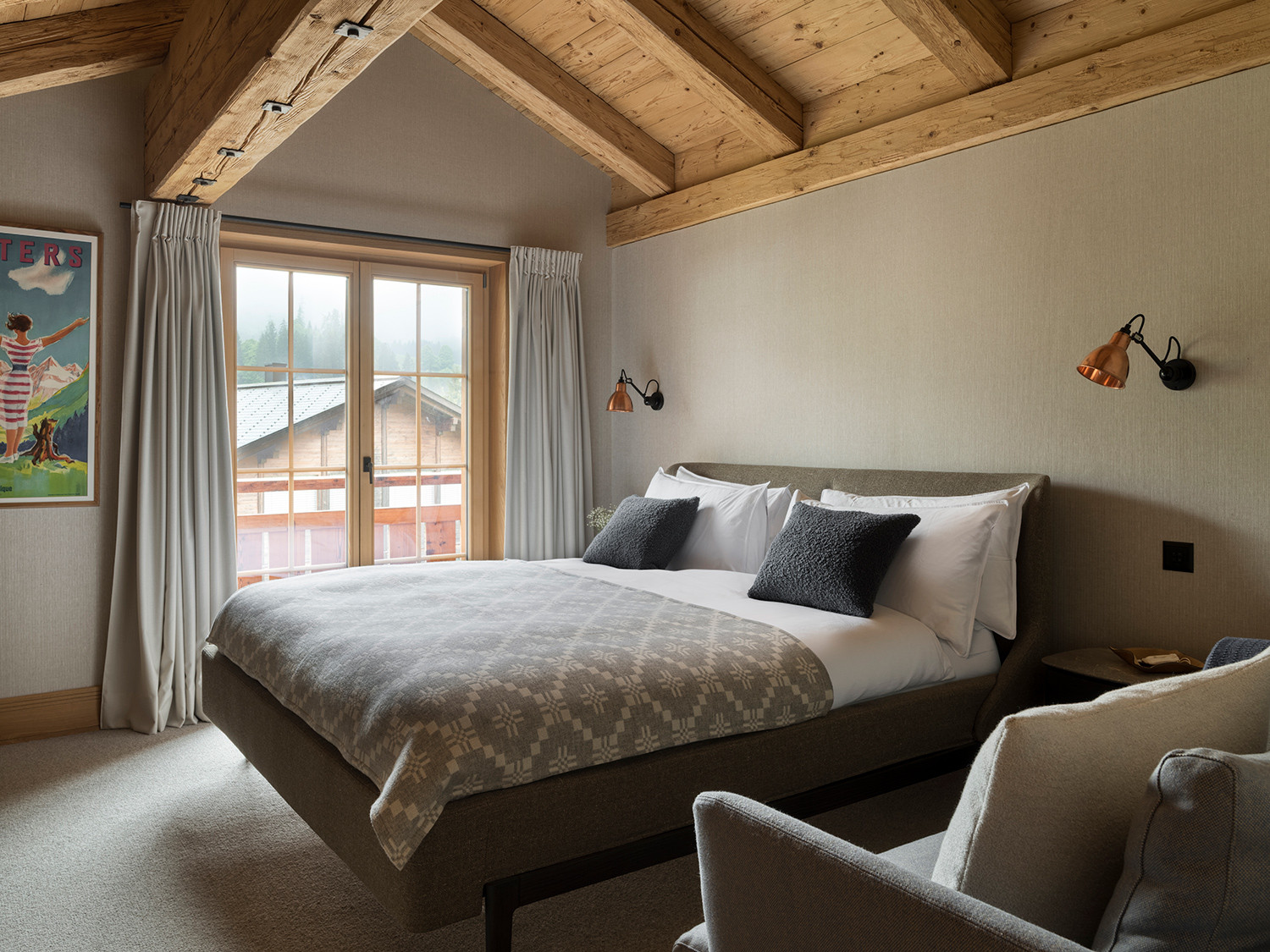 The primary bedroom of the Klosters, Switzerland family chalet, designed by Tollgard Studio