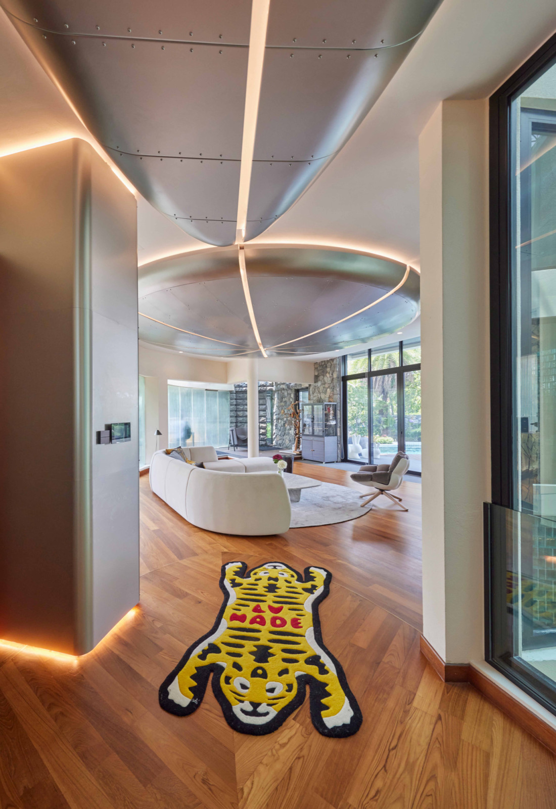 A tiger-shaped rug adds a playful note to the hallway linking different areas