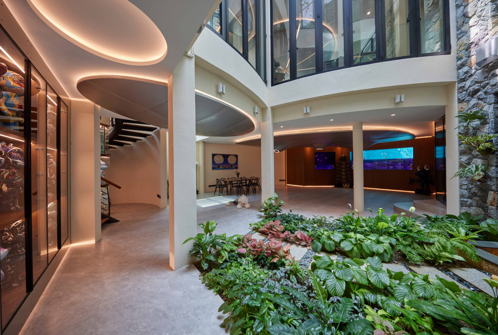 The bungalow’s spacious basement level is brightened by natural light entering from the planted courtyard