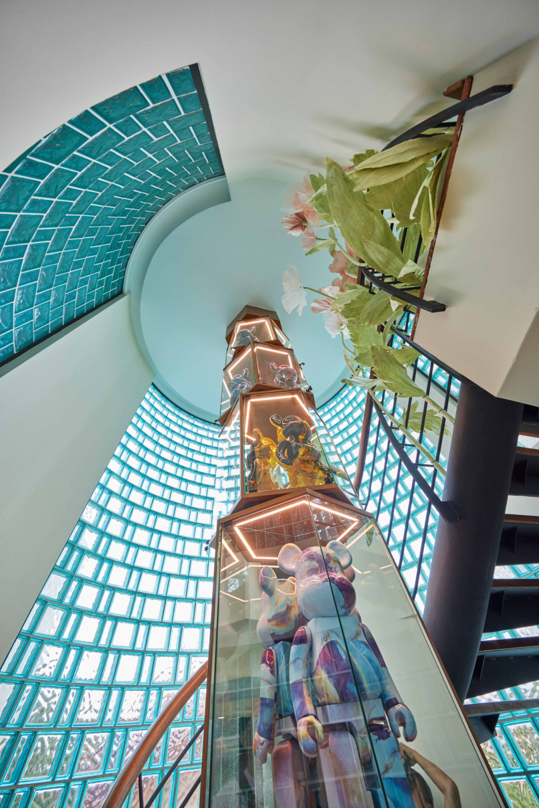 Seen from below, the Tower rises through the bungalow, connecting multiple storeys