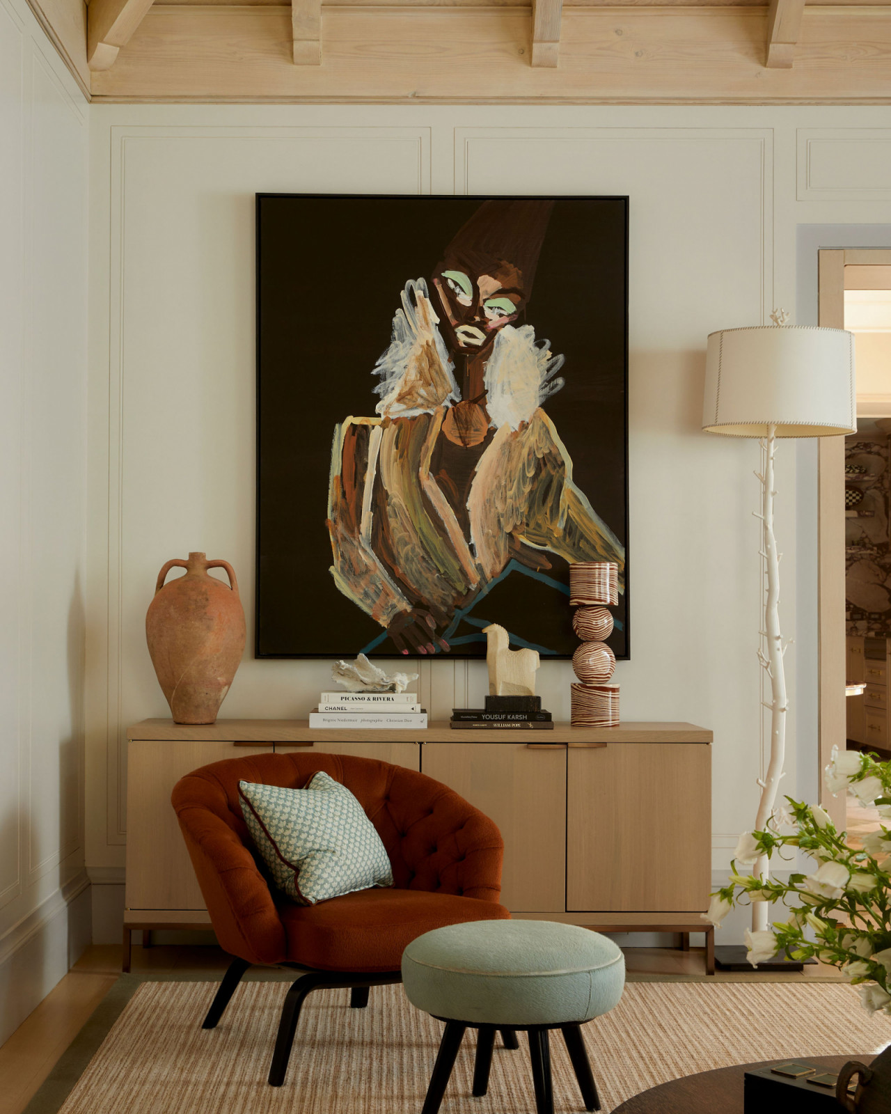 Pops of colour and art in the living room of an Ontario, Canada mansion renovated by Sabrina Albanese Interiors