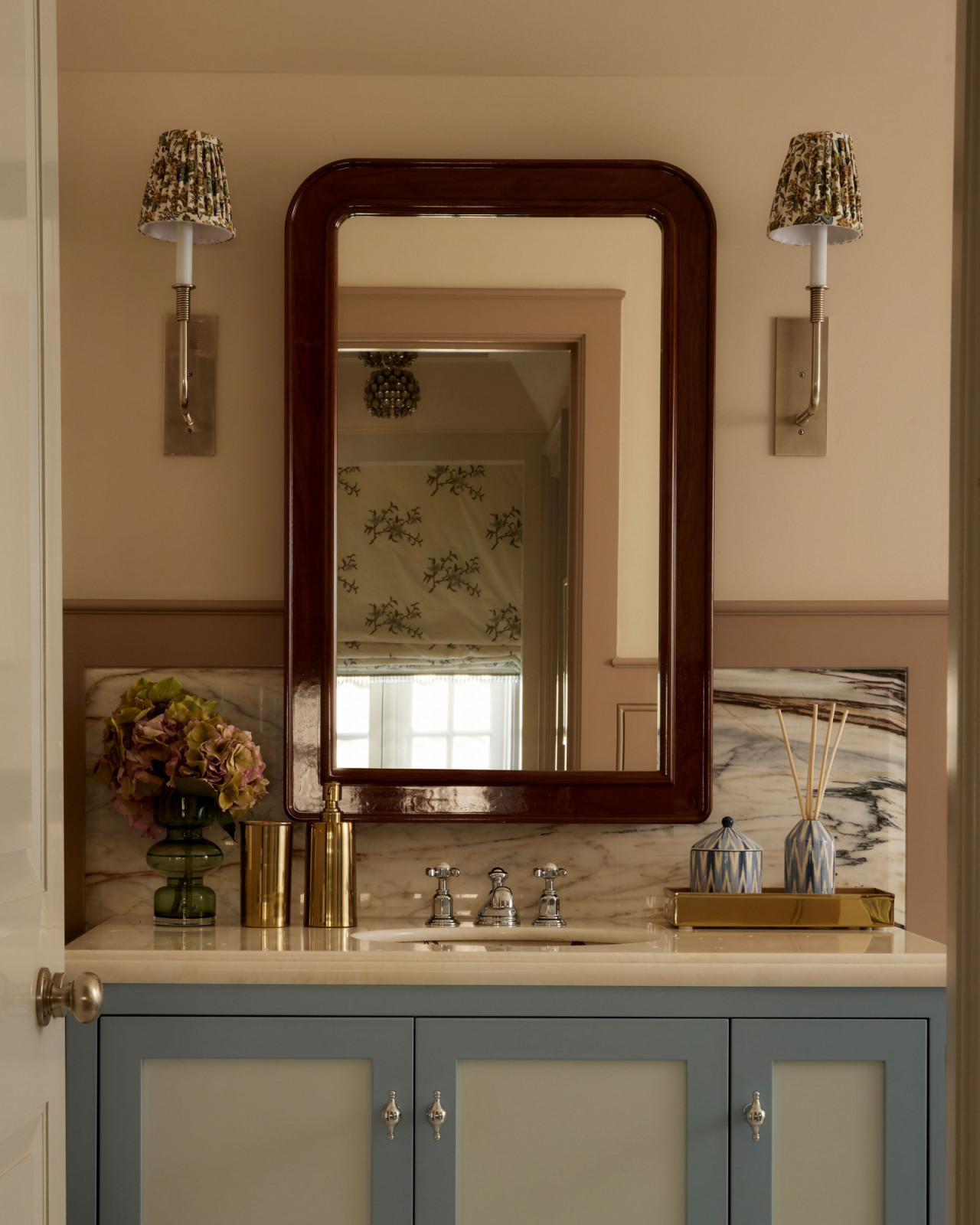 The powder room of an Ontario, Canada mansion renovated by Sabrina Albanese Interiors