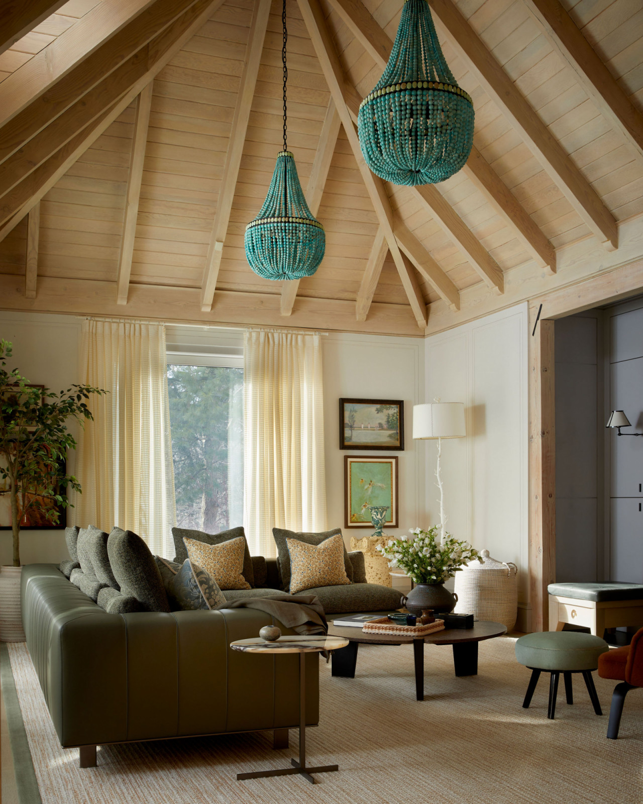 Unexpected turquoise lighting in a gathering area of an Ontario, Canada mansion renovated by Sabrina Albanese Interiors
