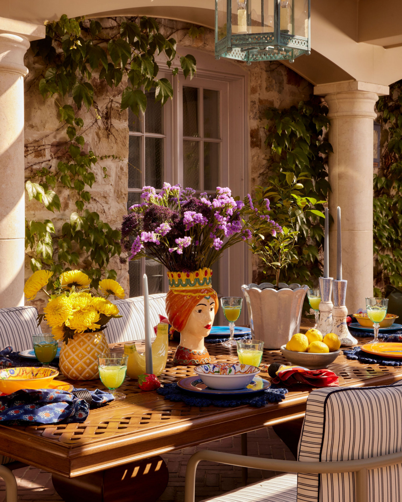 The vibrant tablescape in the backyard of an Ontario, Canada mansion renovated by Sabrina Albanese Interiors