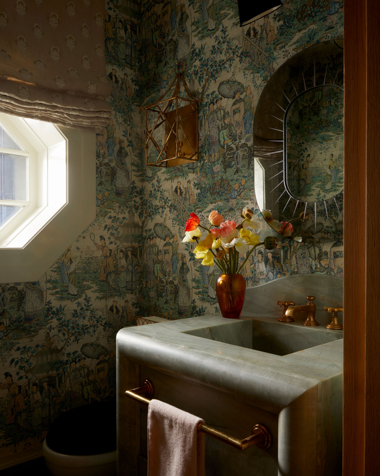 The powder room of an Ontario, Canada mansion renovated by Sabrina Albanese Interiors