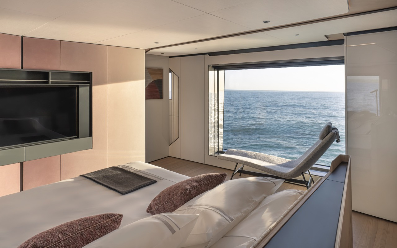 Corner glazing and a built-in chaise position the Azimut Grande 36M owner’s cabin toward the horizon