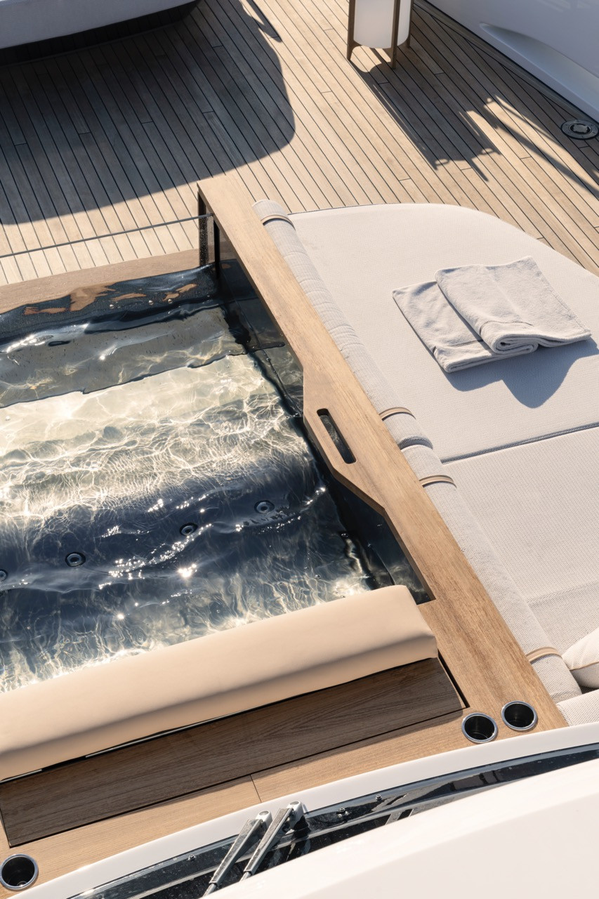 An integrated spa sits flush with teak decking on the Azimut Grande Trideck forward lounge