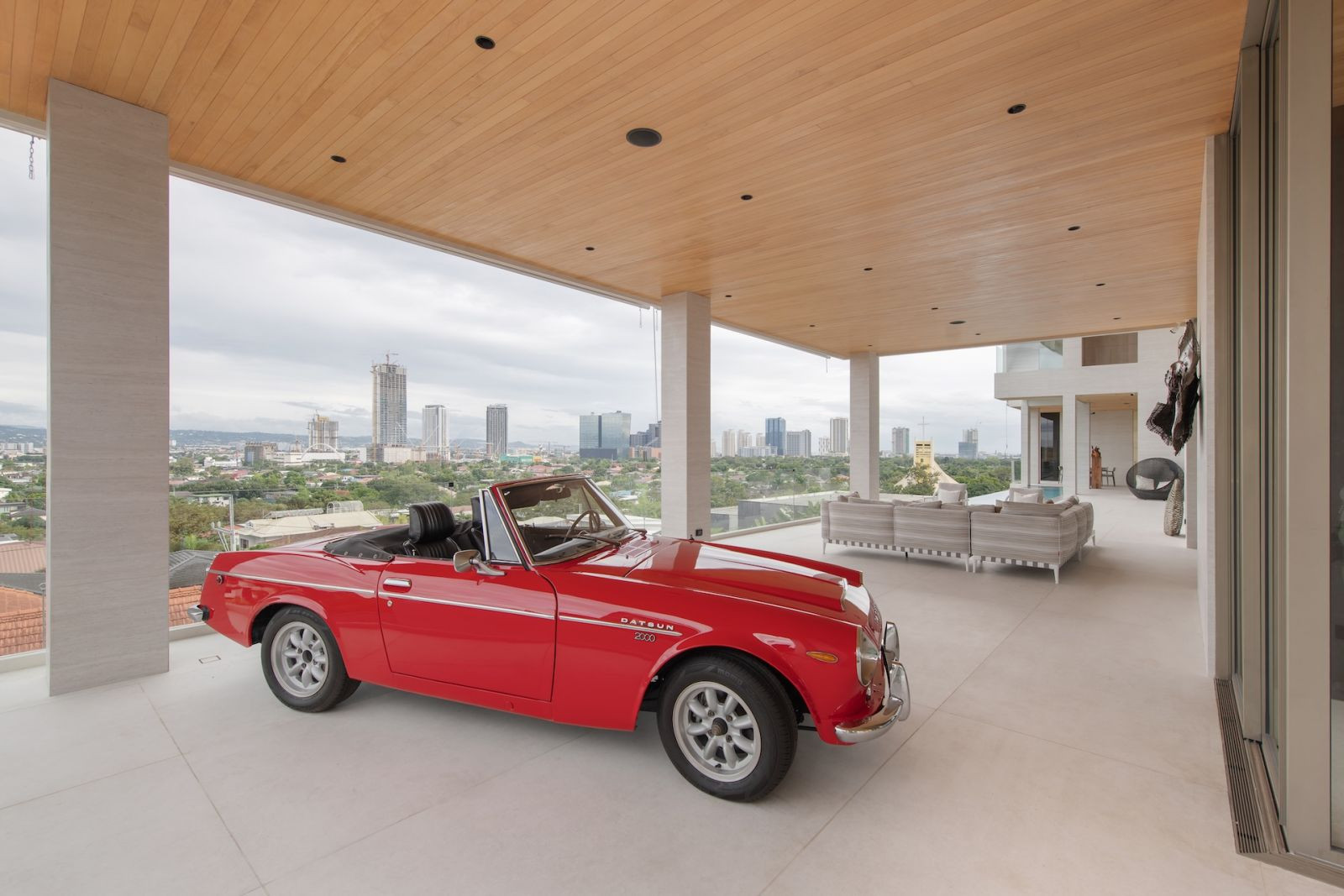 A Datsun 2000 Roadster convertible on display by the whiskey room (Photo: Greg Mayo)