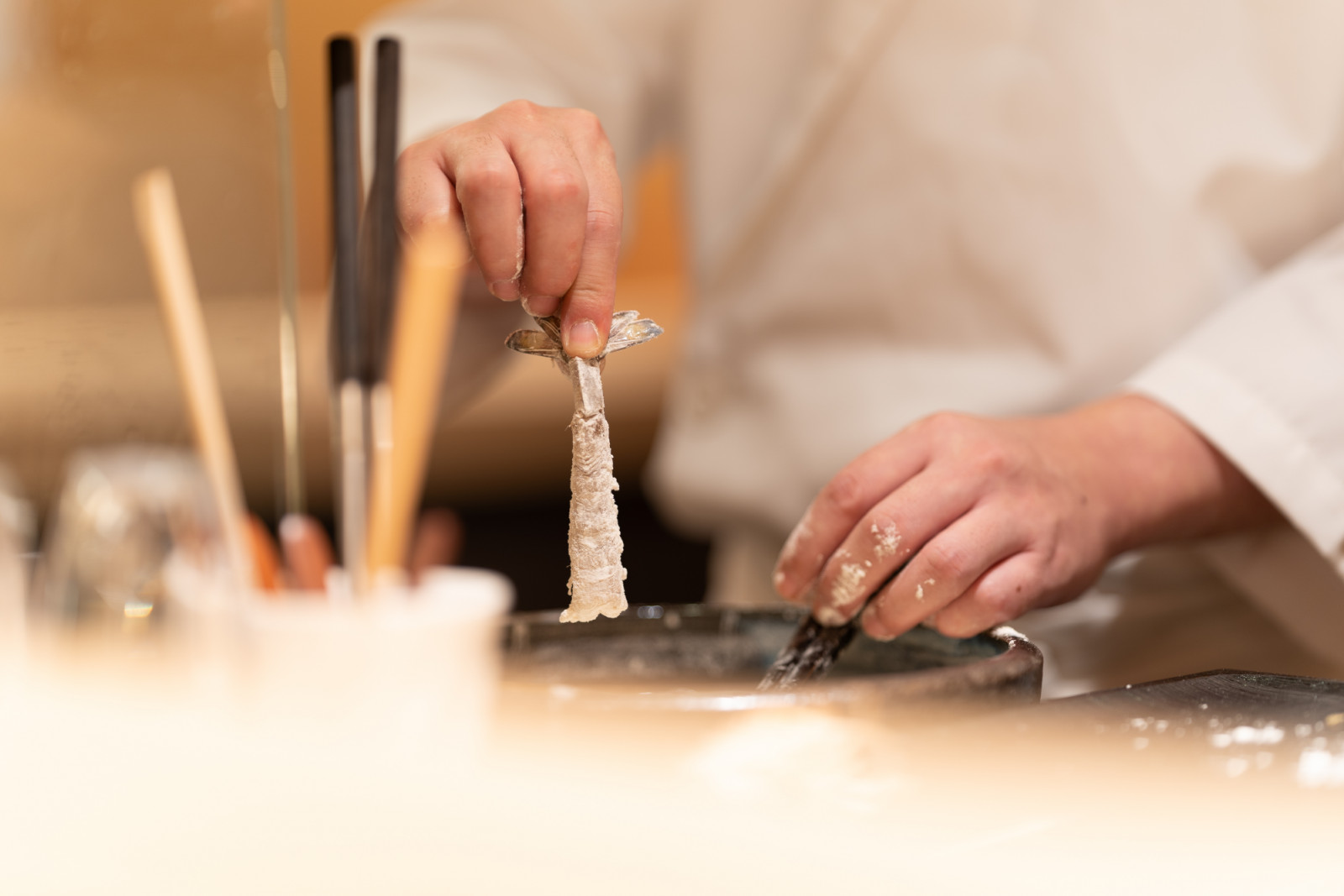 Ebi tempura coated in a thin batter and deep-fried to perfection