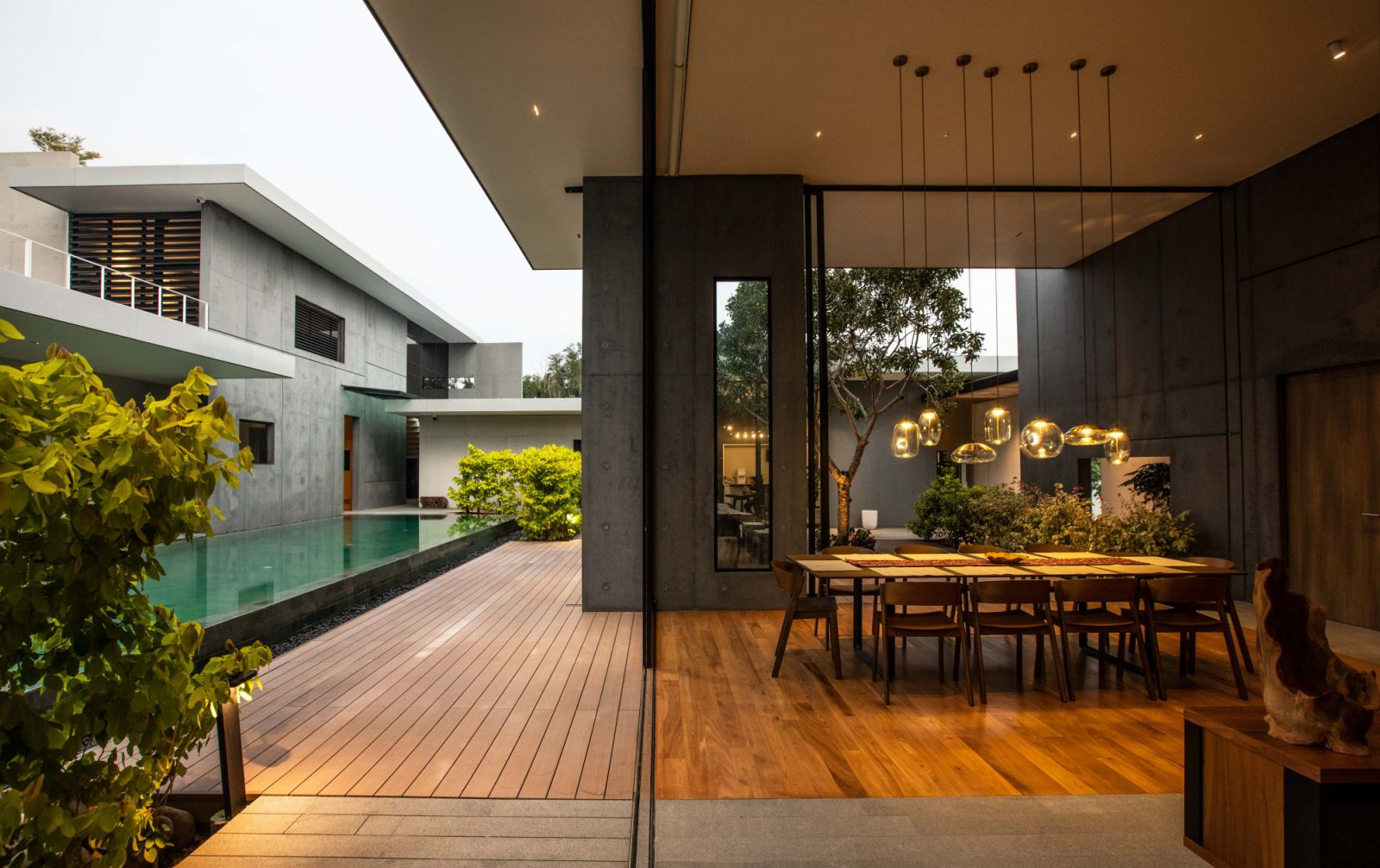 Concrete cast complements timber flooring amidst the ever-present natural elements (Photo: Ameen Deen)