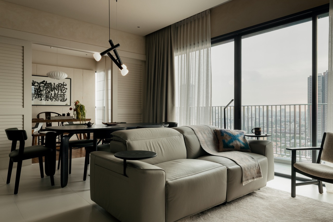 The King Living sofa anchors the living area, which opens to views across Kuala Lumpur through floor-to-ceiling windows