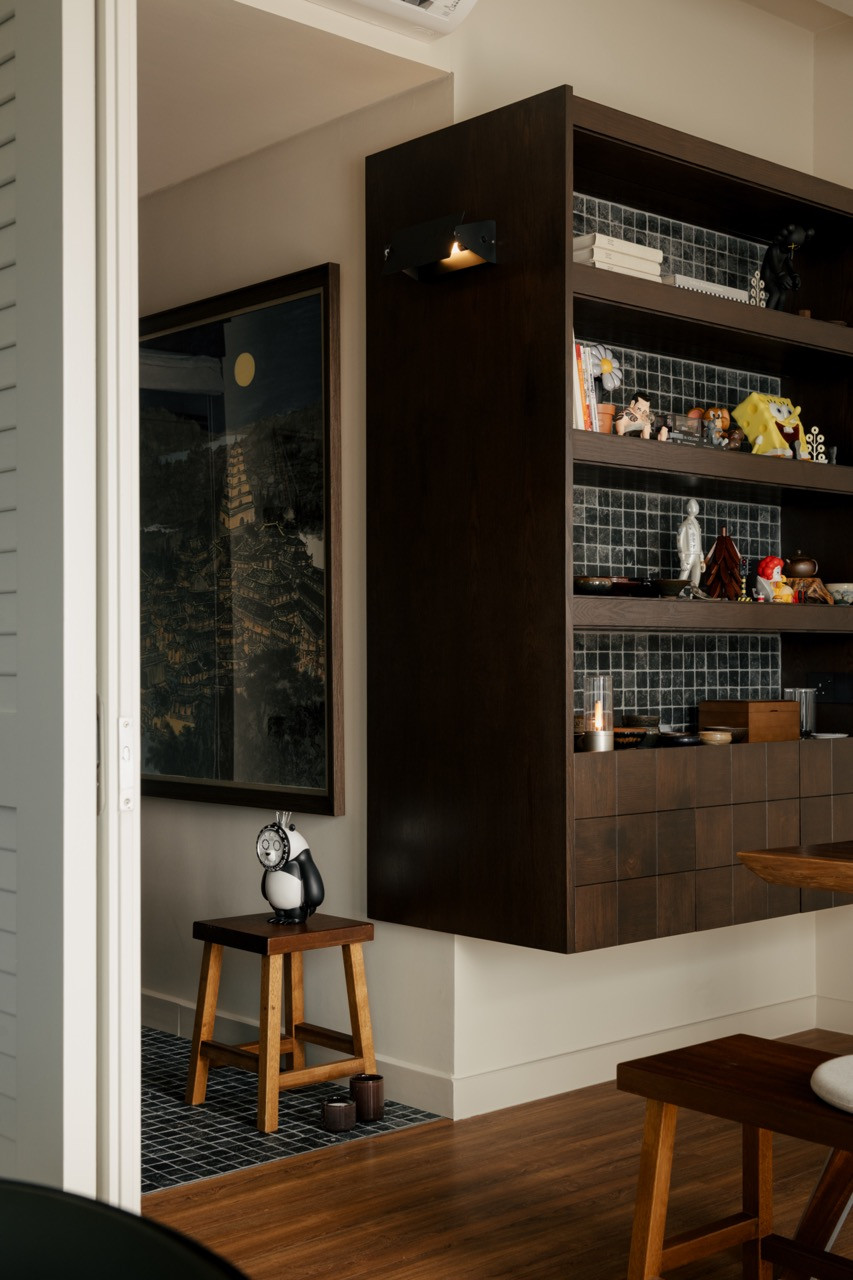 The home office opens to the living area through solid-wood louvre sliding doors, providing flexibility to the space