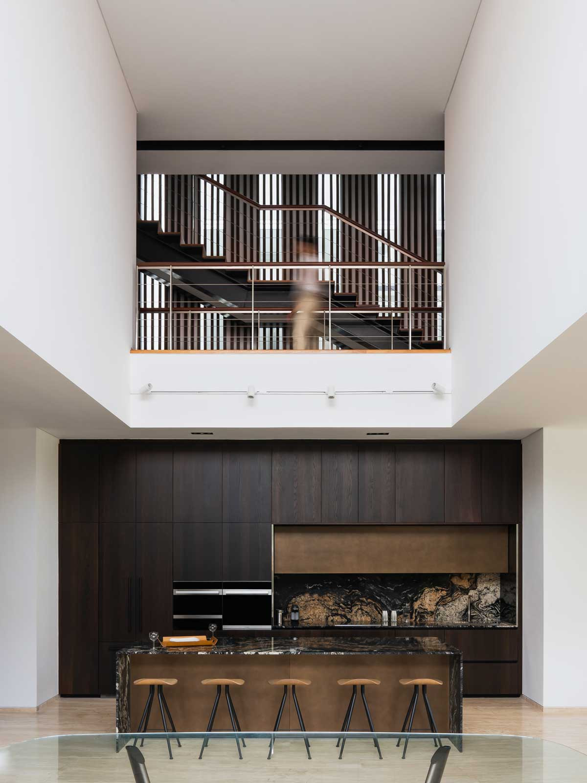 The double-volume ceiling lends drama to the dining space