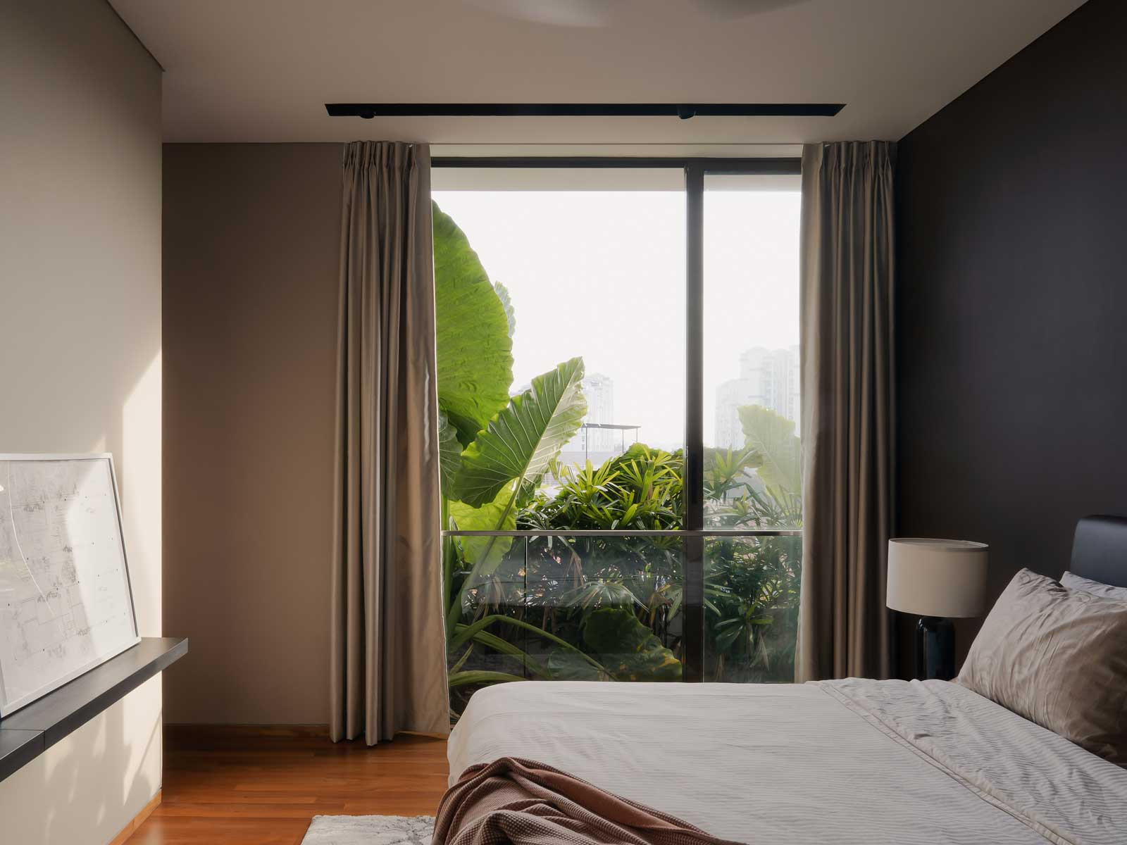 This bedroom is replete with biophilic goodness thanks to its sizeable window