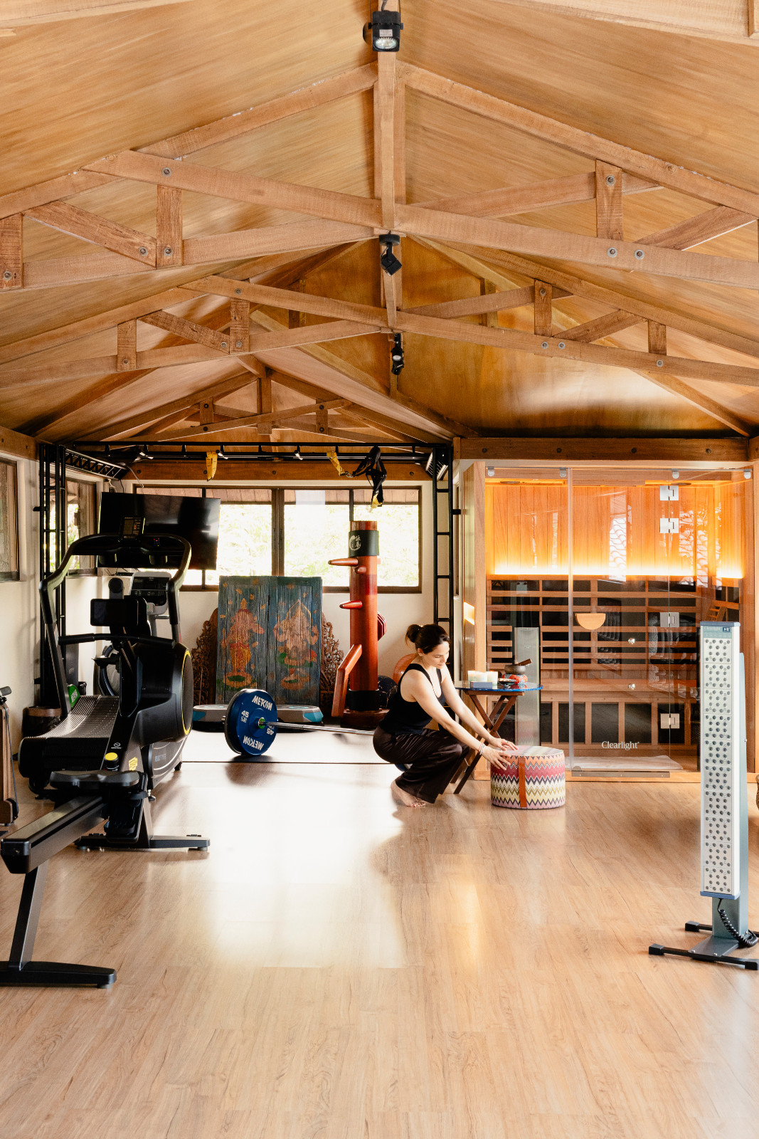 Monique Borja-Gonzalez mindfully arranges a colourful stool at her home gym