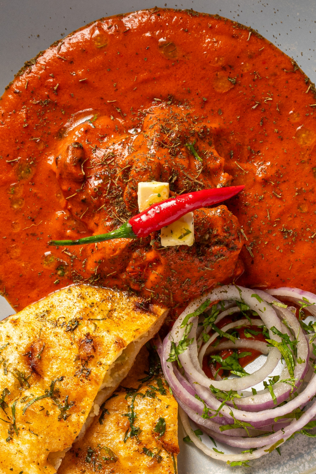 Roasted butter chicken with roasted cashew nuts at Agni by Mantra