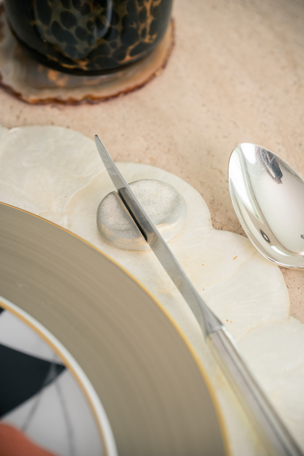 A pebble found by Stephanie Kienle Gonzalez repurposed as a knife rest on her tablescape