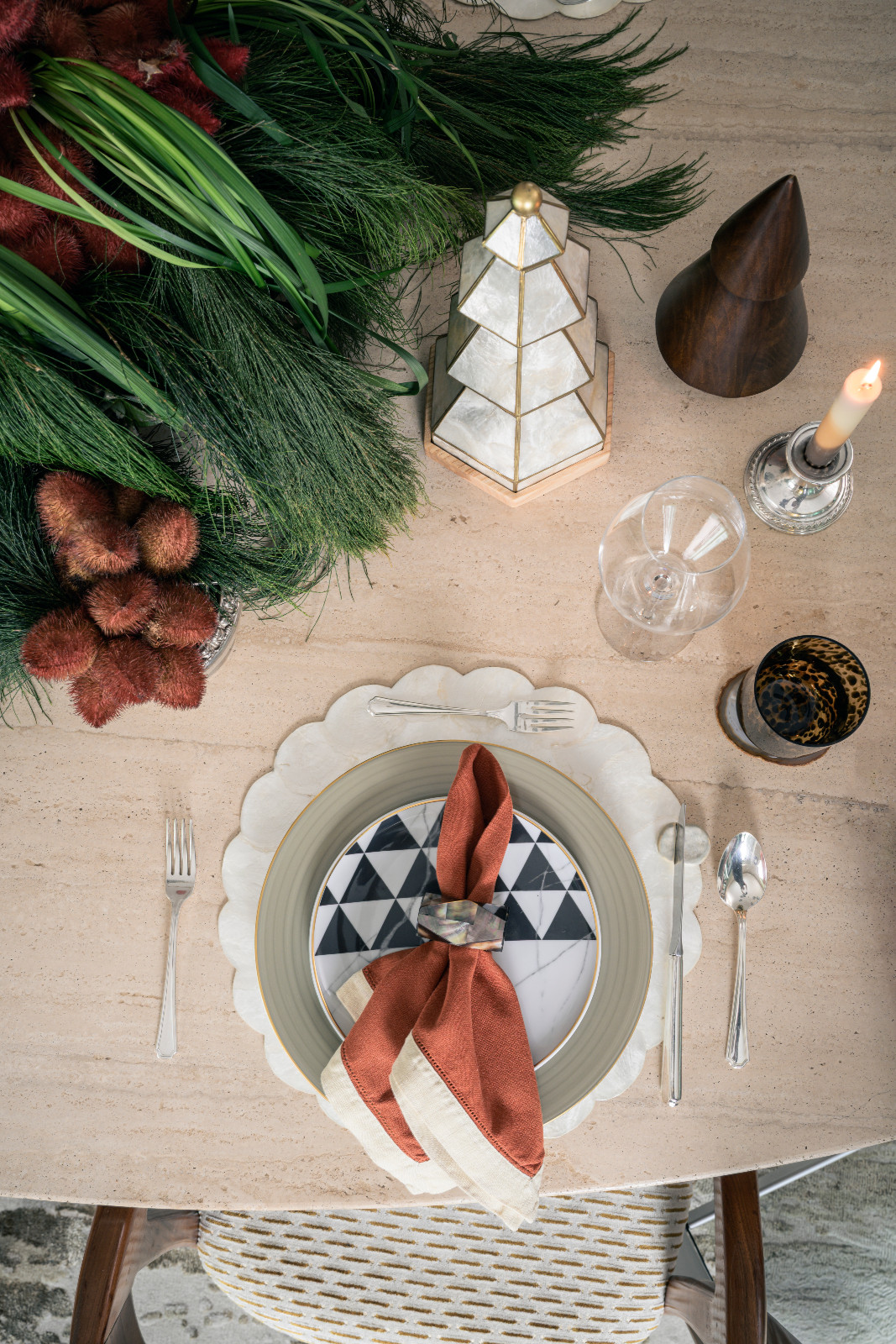 Scalloped capiz placemat beautifully contrasting the geometric print of the salad plate on Stephanie Kienle Gonzalez's table