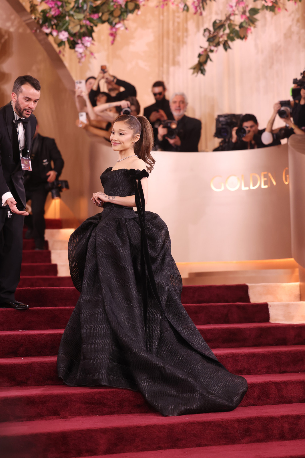 Ariana Grande wearing a voluminous black Vivienne Westwood Couture ball gown with corseted bodice