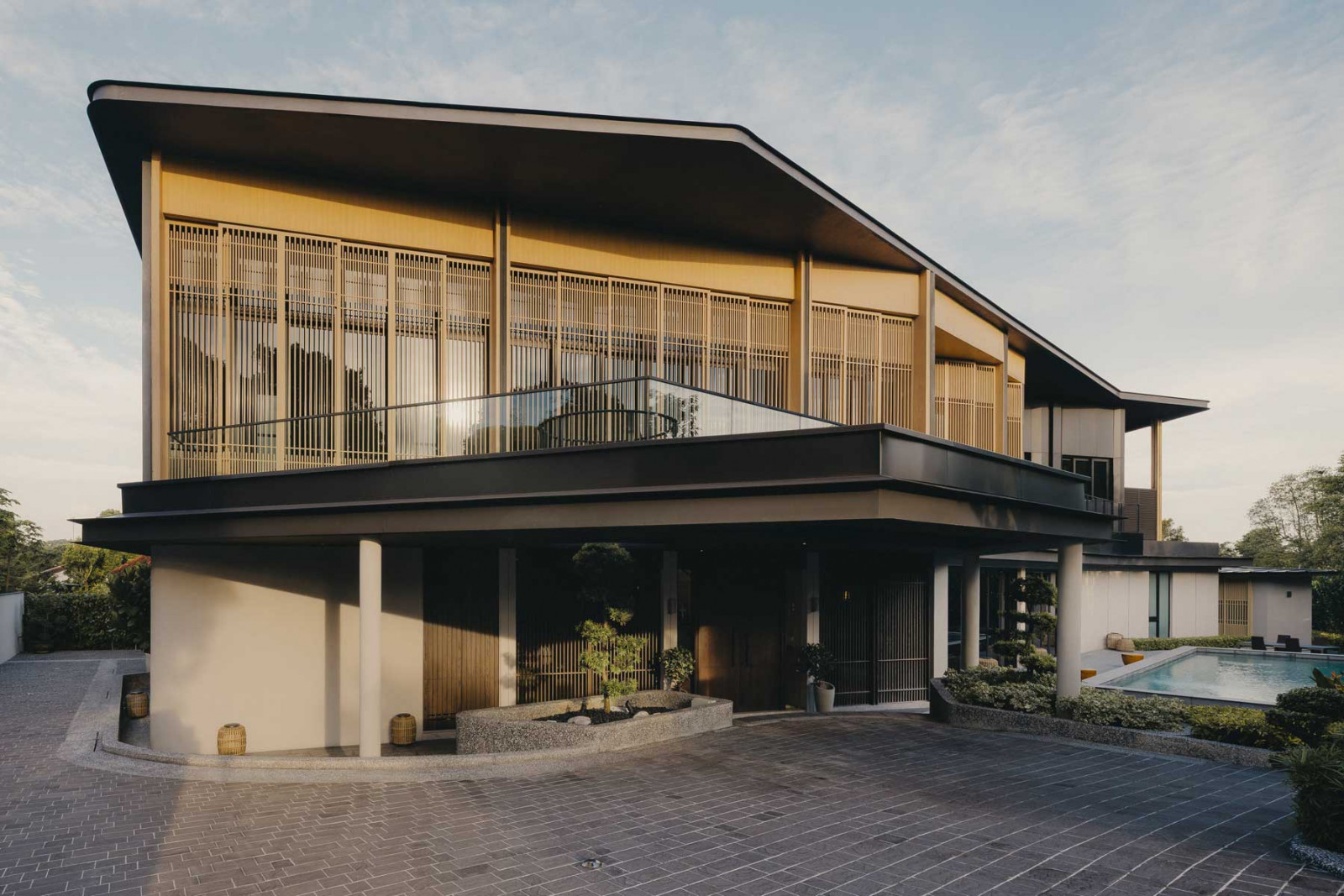 The exterior view of the Bukit Timah Good Class Bungalow, christened Skyveil House, showcases its namesake “veil”, whose form was inspired by birdcages